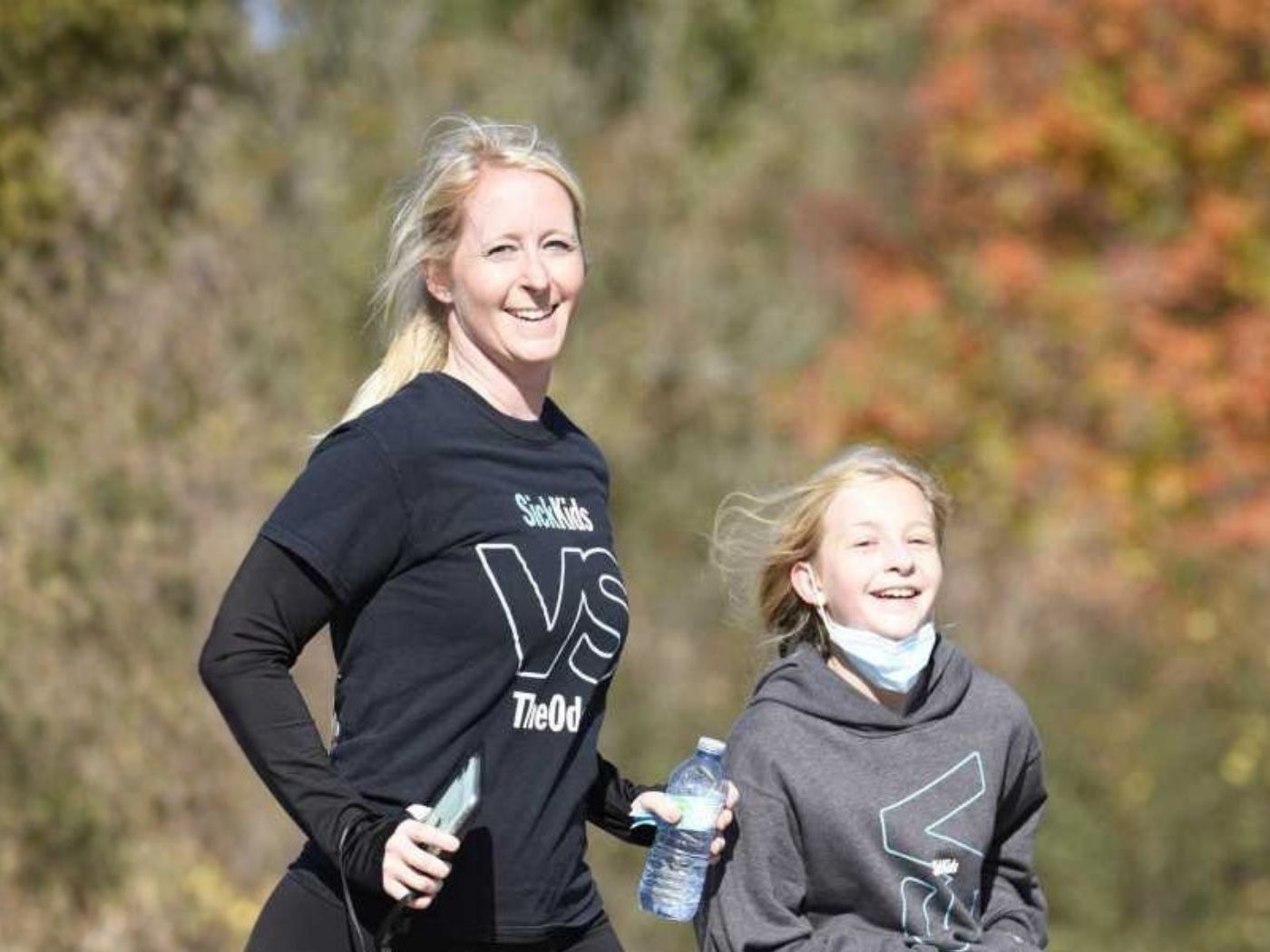 Adult and child participating together in the Art In Motion charity race in Vaughan