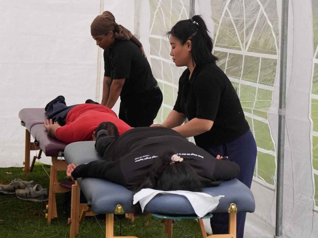Runners receiving complimentary post-race massages at the Art In Motion charity run in Vaughan